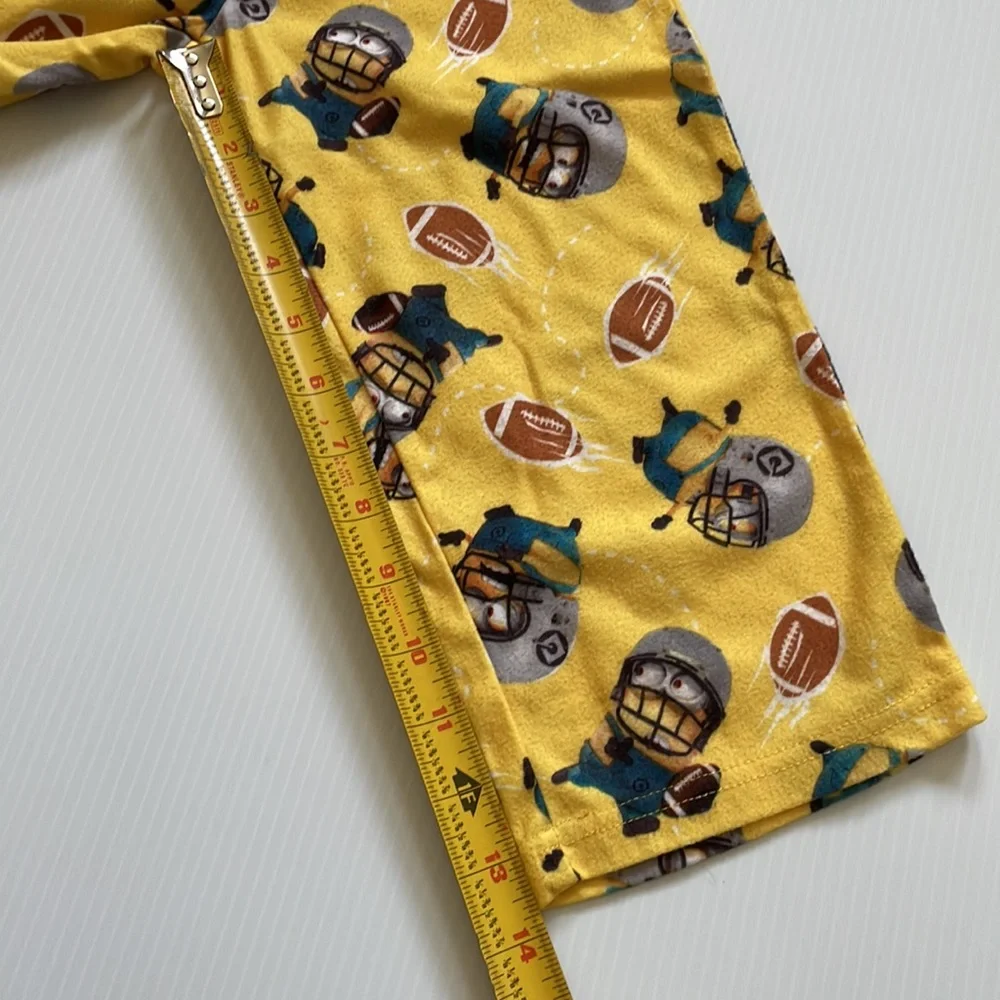 Minions yellow football pajama top & bottoms.  Size 4